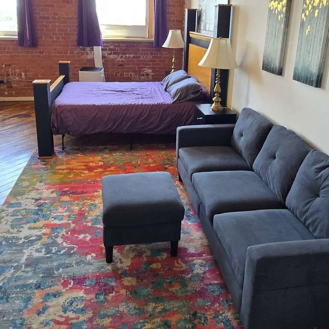 Detroit MotorCity Riverfront Loft couch and bed