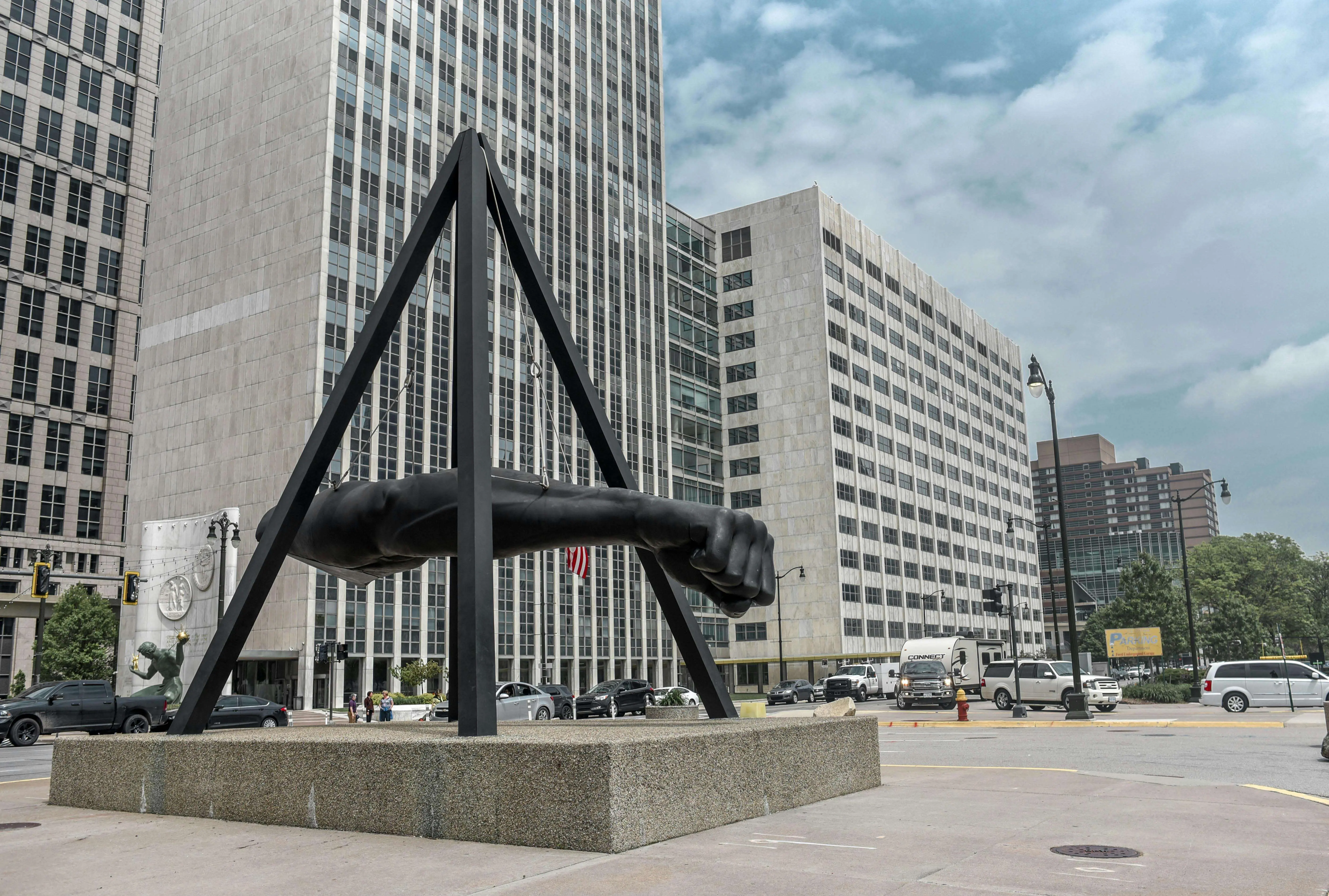 Urban scene featuring the iconic Joe Louis Fist in downtown Detroit.