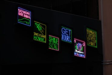 Detroit dive bars neon lit exterior at dusk - Detroit dive bars